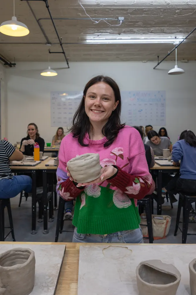Chicago Girls Who Walk members with their pottery at a past social at The Pottery Loop