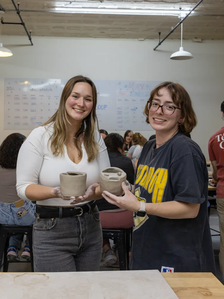 Chicago Girls Who Walk members with their pottery at a past social at The Pottery Loop
