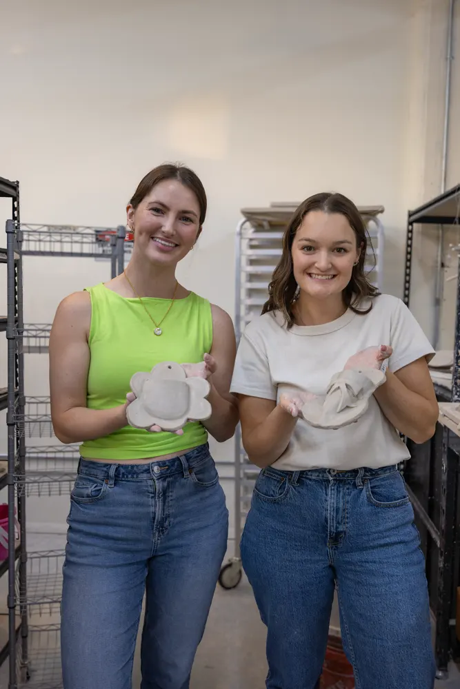Chicago Girls Who Walk members with their pottery at a past social at The Pottery Loop