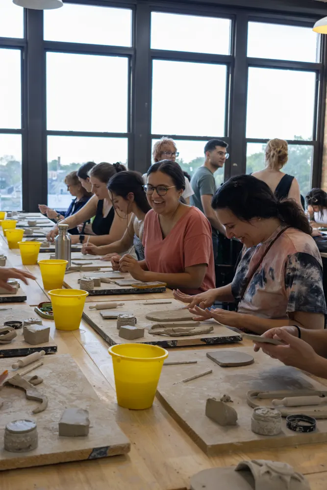 Chicago Girls Who Walk members with their pottery at a past social at The Pottery Loop