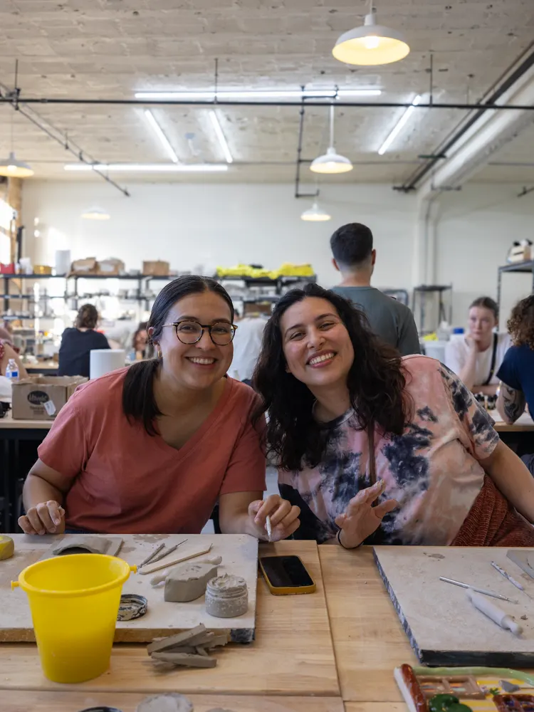Chicago Girls Who Walk members with their pottery at a past social at The Pottery Loop
