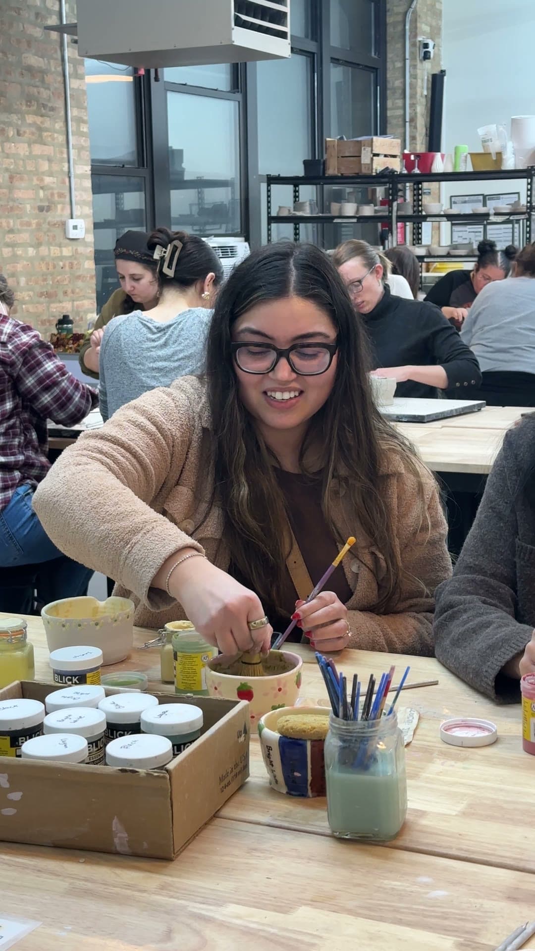 Guest glazing her handmade matcha bowl
